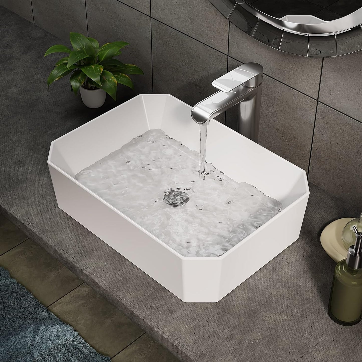 Cloakroom basin filled with water, showcasing its depth and smooth ceramic finish.