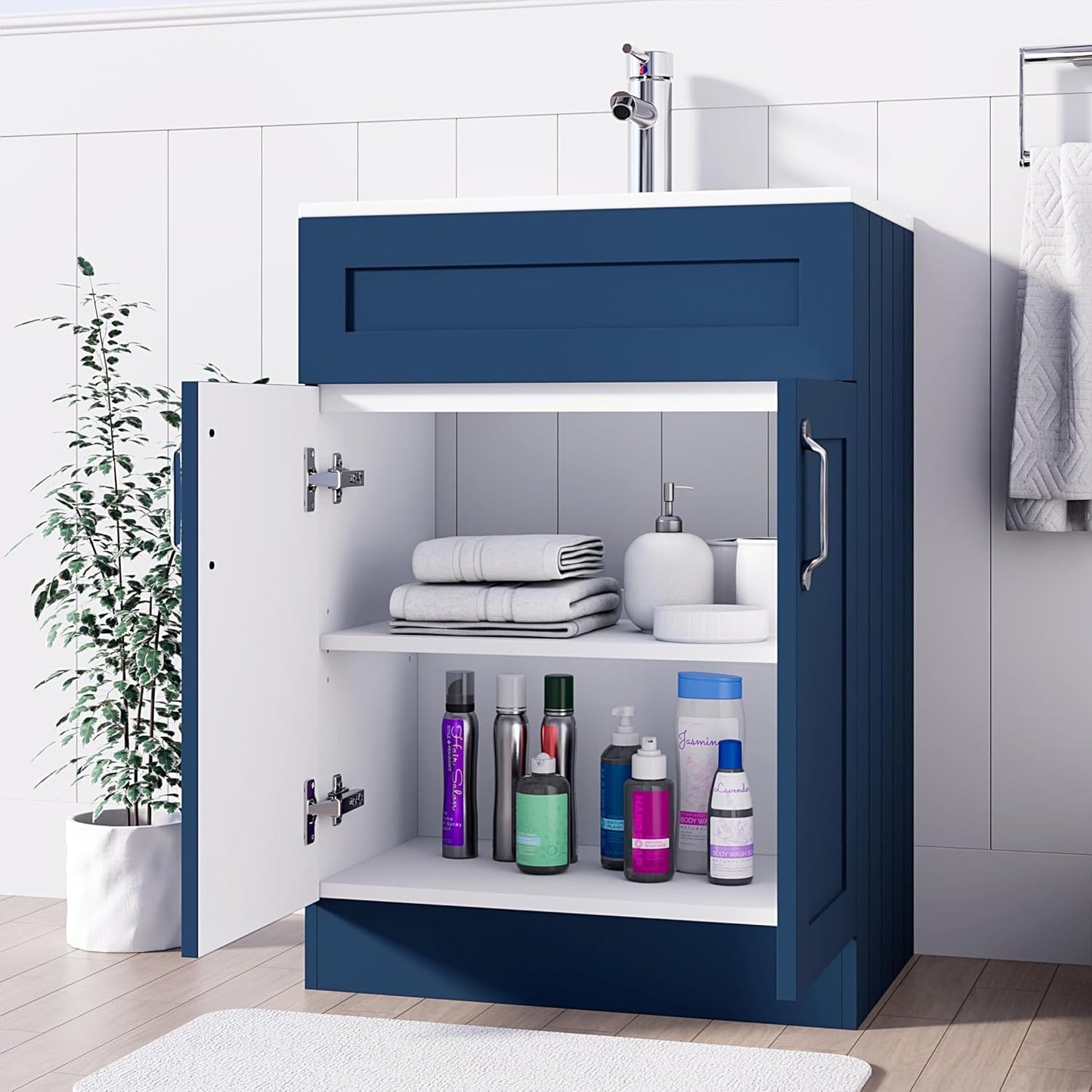 Crawley Blue 600mm vanity unit with open storage, neatly arranged towels and toiletries.