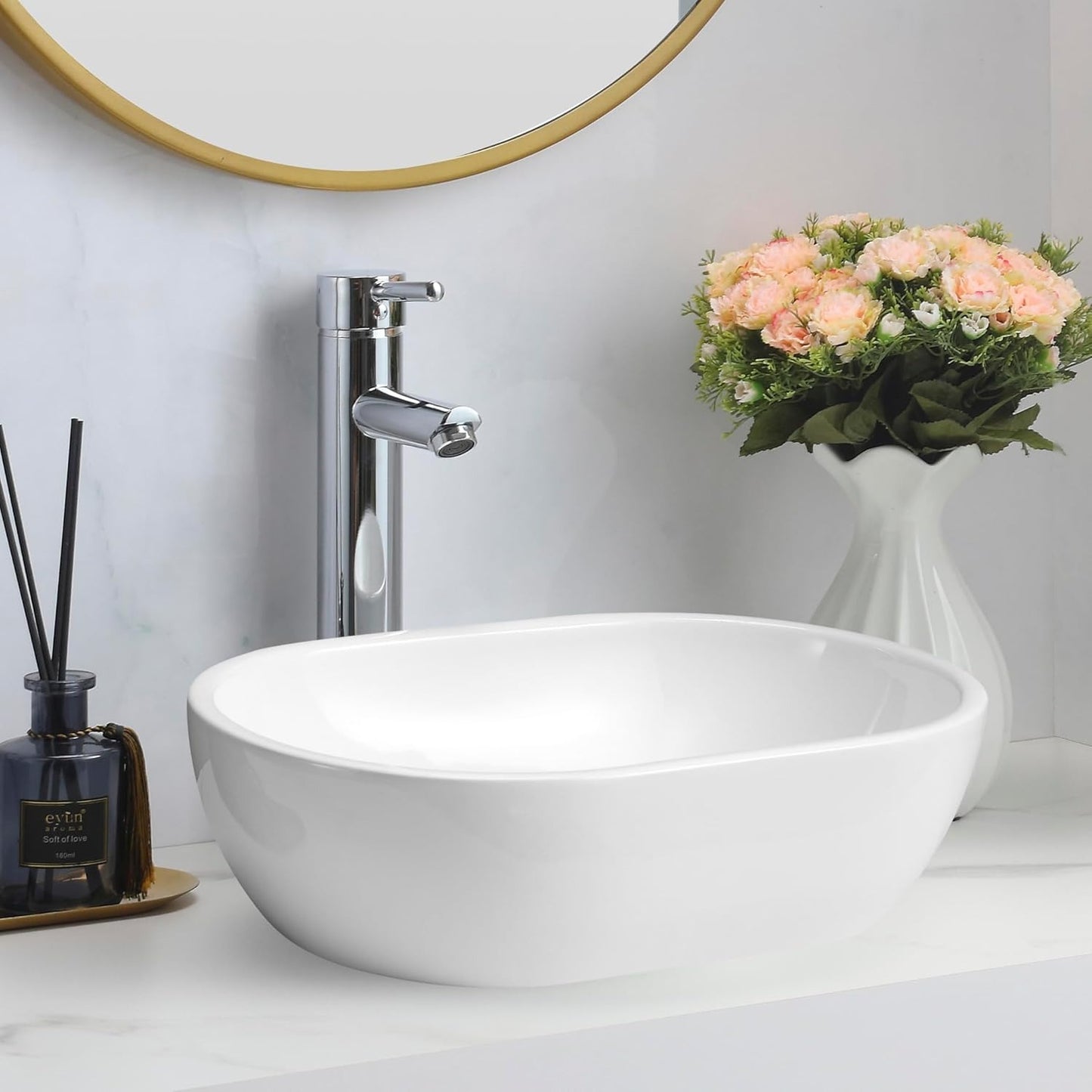 Gloss white rectangular counter top basin on a white vanity with a tall chrome tap.
