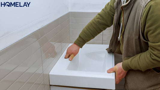 a man installing a vanity unit