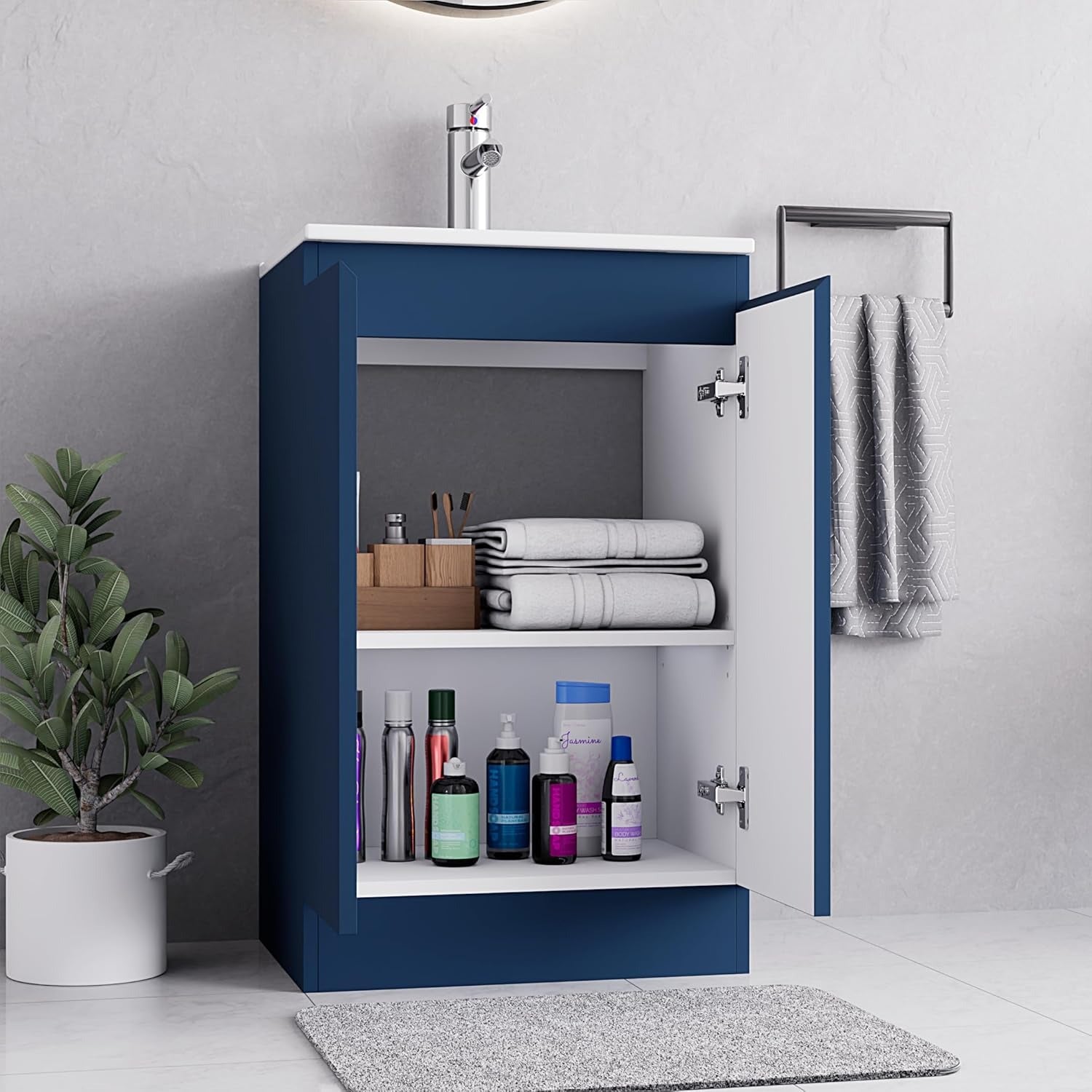 500mm navy blue vanity unit with open storage, showcasing neatly arranged towels and toiletries.
