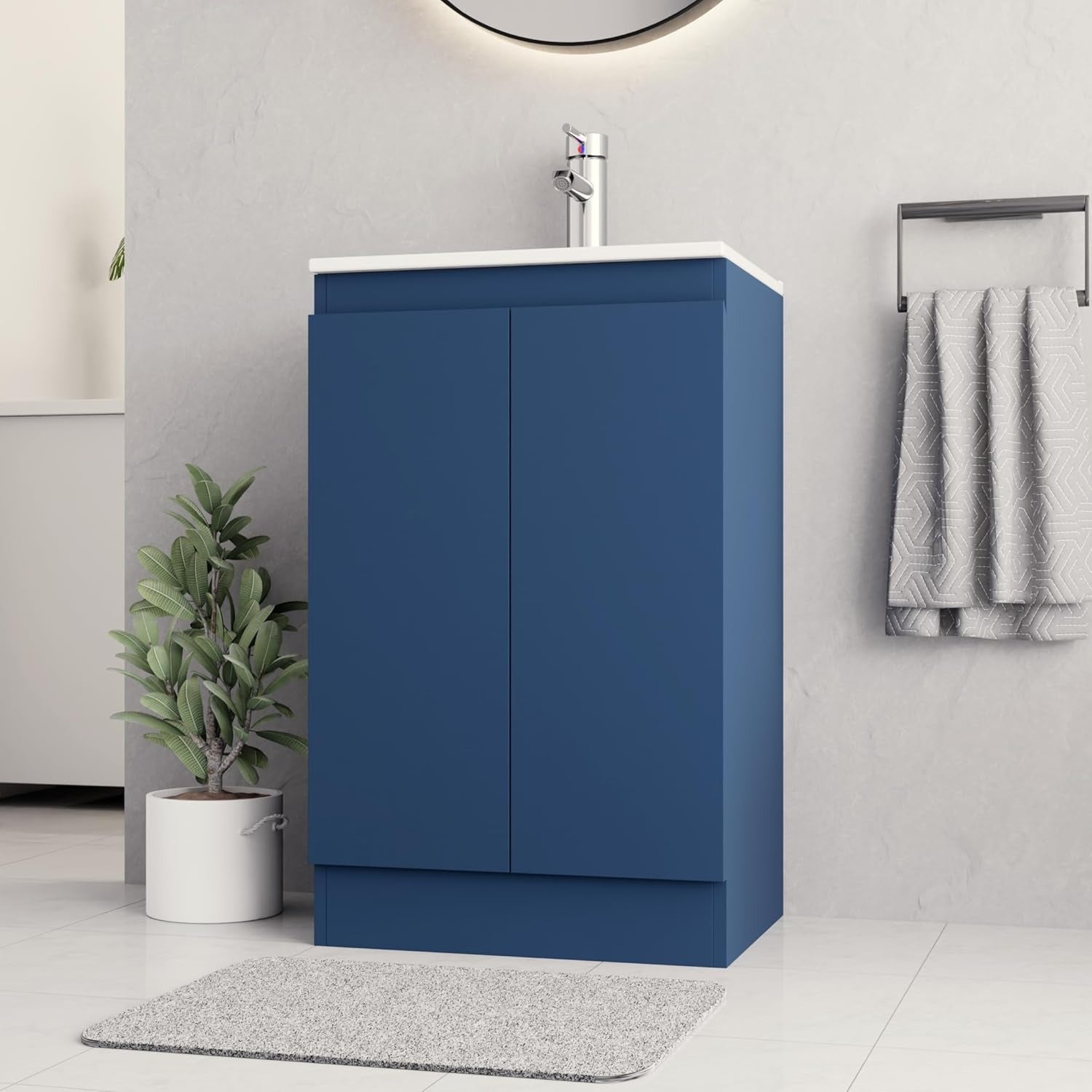 Side view of 500mm navy blue vanity unit with chrome tap and a modern sleek design.