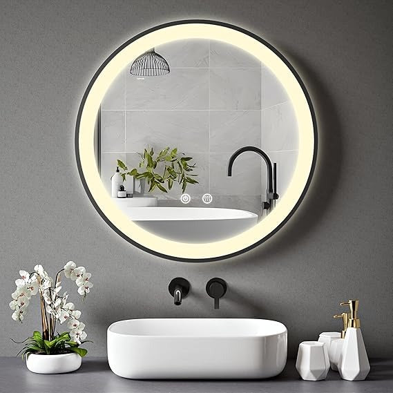 Homelay Stella 500mm Black Framed Round LED Bathroom Mirror with integrated LED lighting, displayed above a modern sink with minimalist decor.