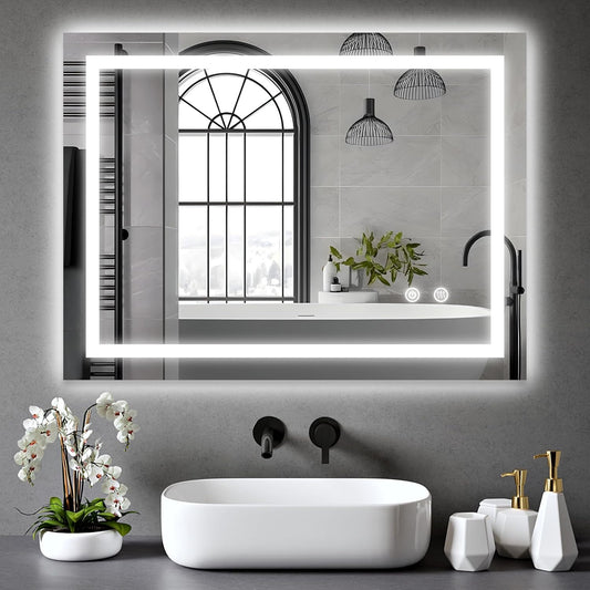 Clara 60x80cm LED bathroom mirror installed above a modern sink with anti-fog and dimmable LED lighting.