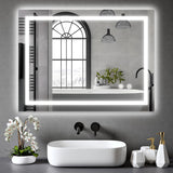 Clara 60x80cm LED bathroom mirror installed above a modern sink with anti-fog and dimmable LED lighting.