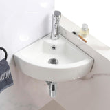 Sleek white ceramic corner basin with a minimalist design for cloakrooms.