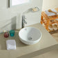 Minimalist bathroom with a round white counter top basin.