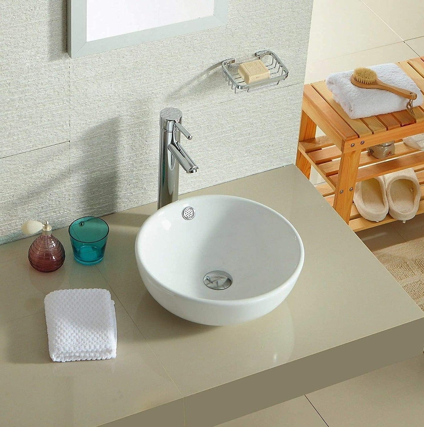 Minimalist bathroom with a round white counter top basin.