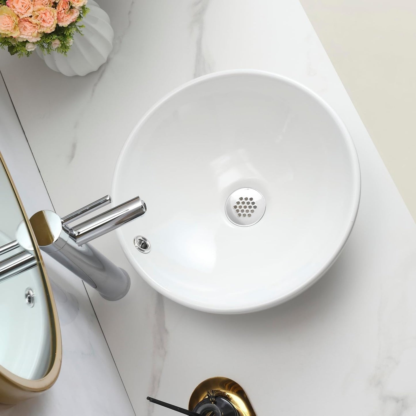 Overhead view of a round white ceramic counter top basin.