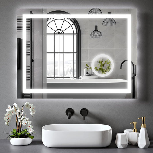 Maxon 70x50cm LED bathroom mirror with magnifier installed above a sink.