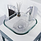 Rectangular glass basin with running water and chrome faucet on countertop.