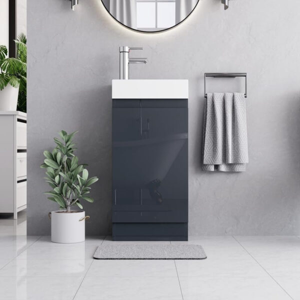 Stylish Denver Grey 400mm Vanity Unit paired with a round mirror, featuring a high-gloss finish and a ceramic basin in a minimalist bathroom setting.